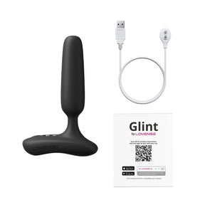 Lovense Glint box contents: smart massager, magnetic USB charging cable and user manual