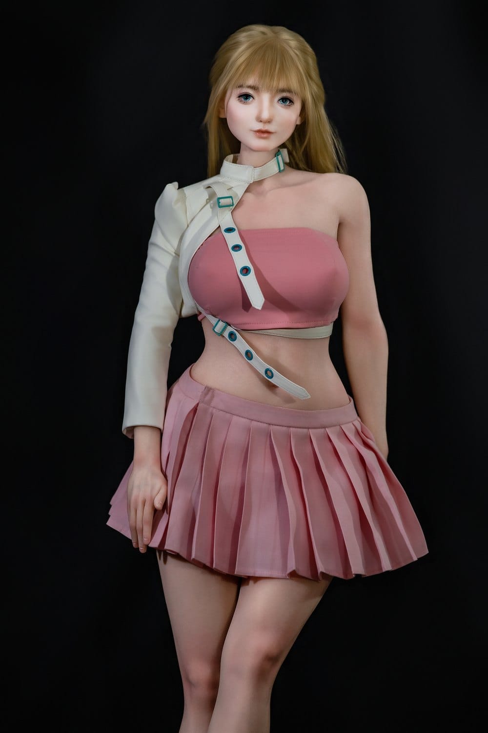 Figure in white jacket and pink pleated skirt