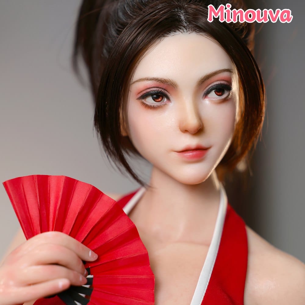 Close-up of hand-painted face with red folding fan
