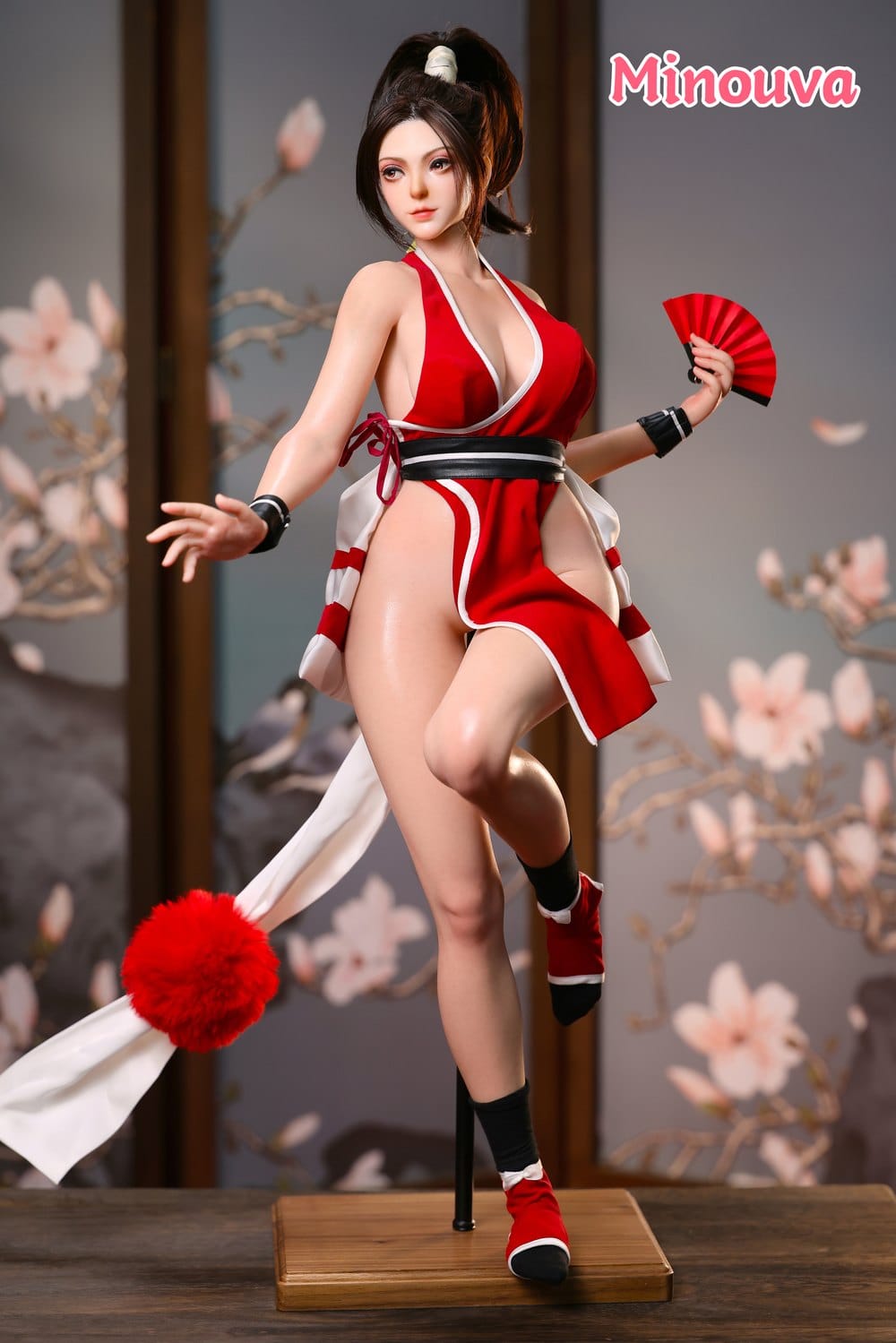 Action pose with red fan in crimson costume