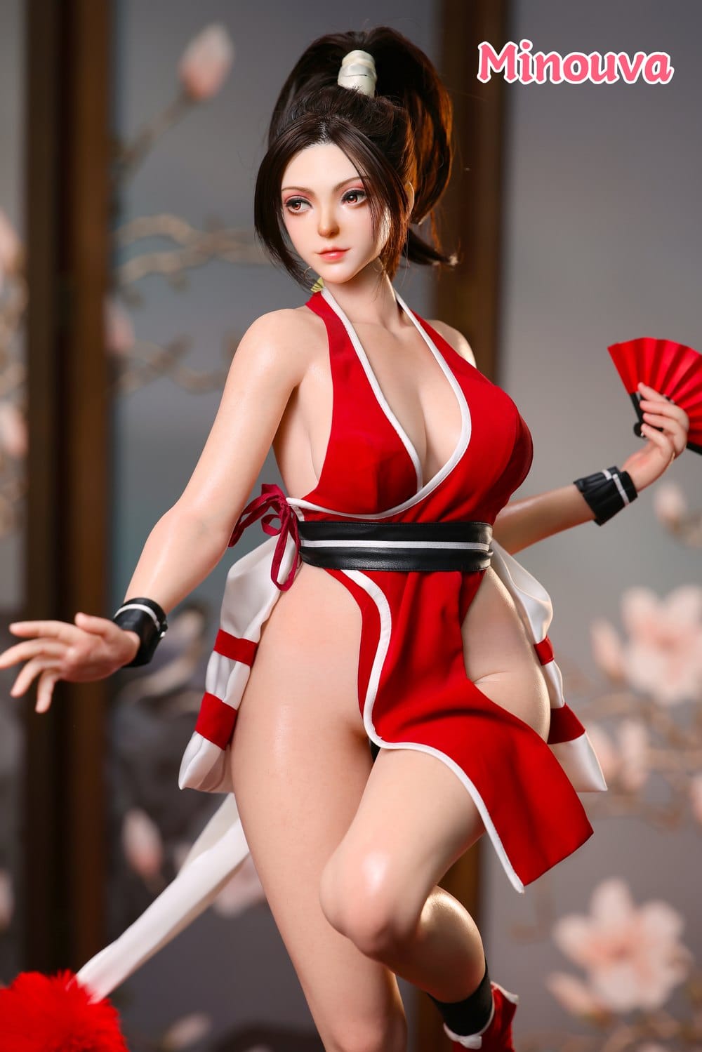 Figure in red costume holding a fan